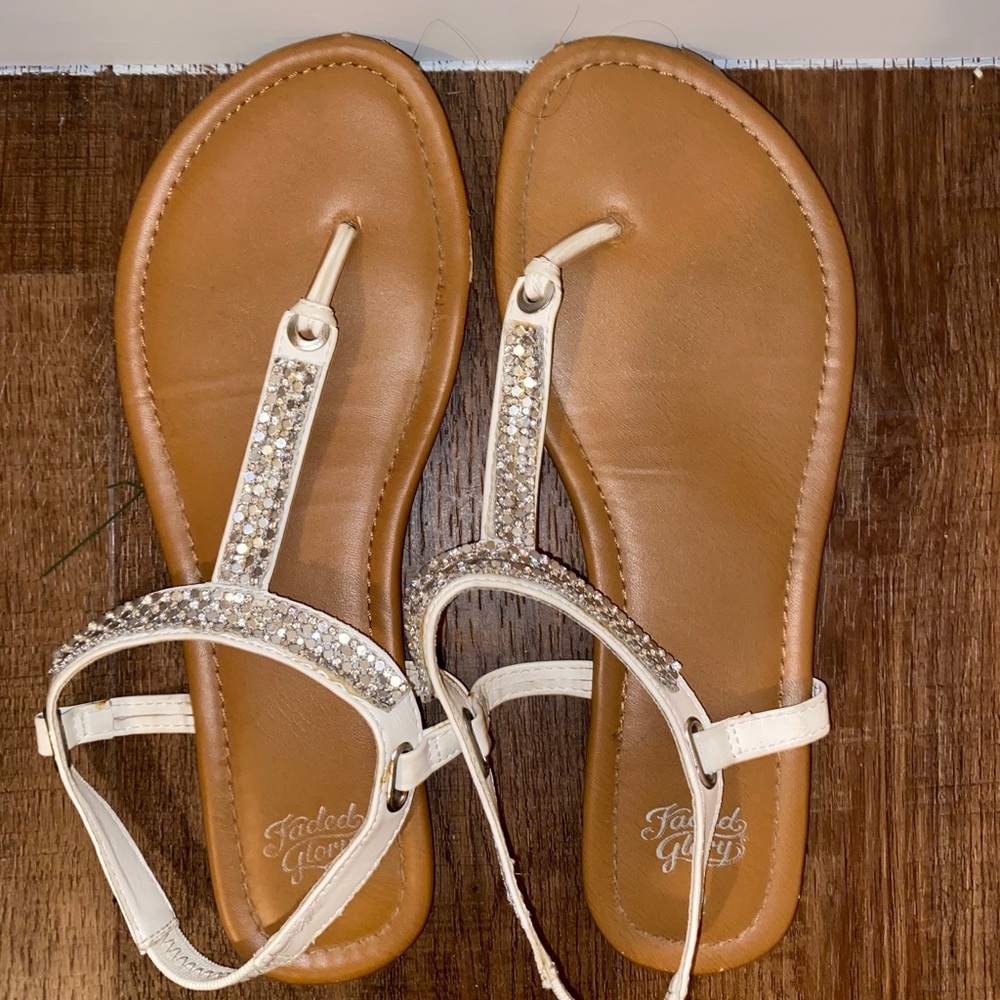 White slip-on sandals with embellishments